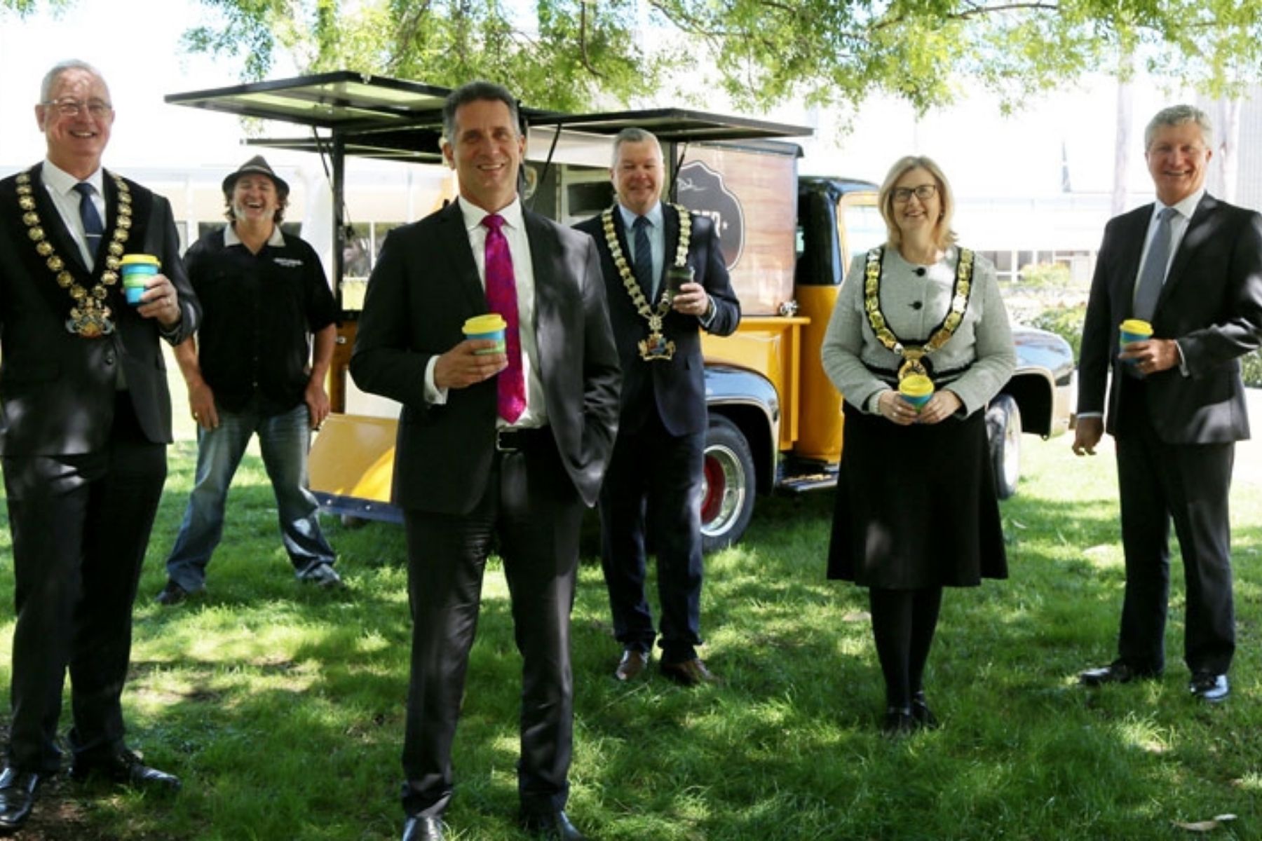 Photo of Image: Mayor David Goode, City of Gosnells; Craig Mauger, Bootlegger Coffee; Hon Paul Papalia CSC MLA, Minister for Small Business; Mayor Patrick Hall, City of Canning; Mayor Karen Vernon, Town of Victoria Park and David Eaton, Small Business Commissioner, celebrating the launch of the Simplified Trading Partnership Permit.