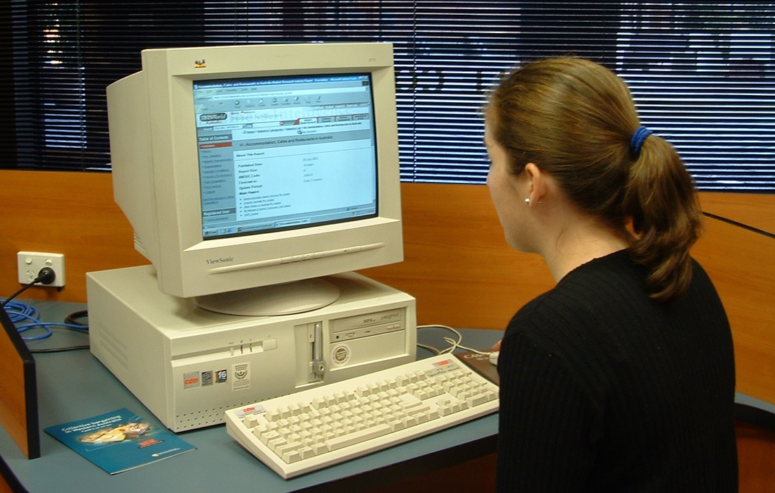 Photo of a woman using a computer.