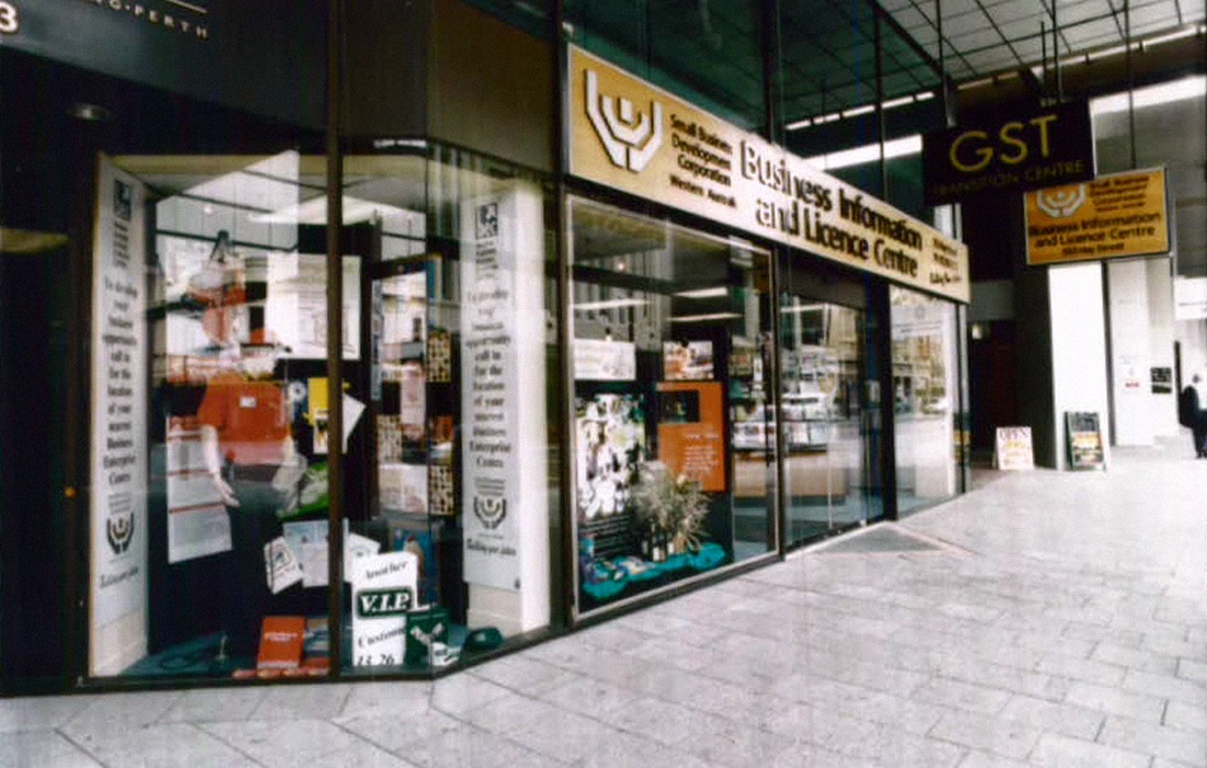 A photo of the outside of the SBDC office in 1999 with a sign promoting the GST Transition Centre.